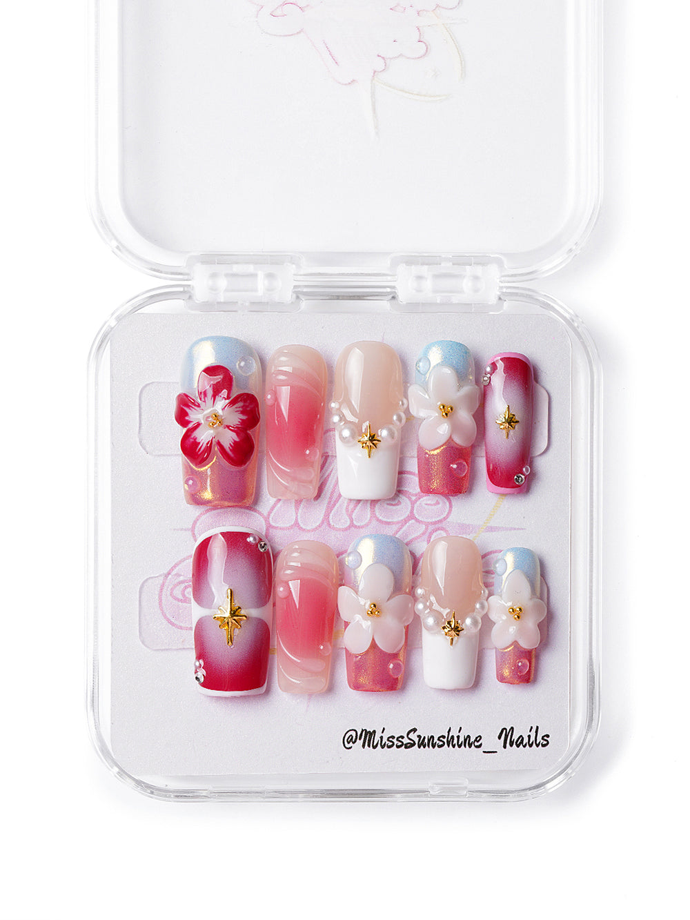Handmade floral nails with pearl accents, shimmer, and soft pink-white ombré