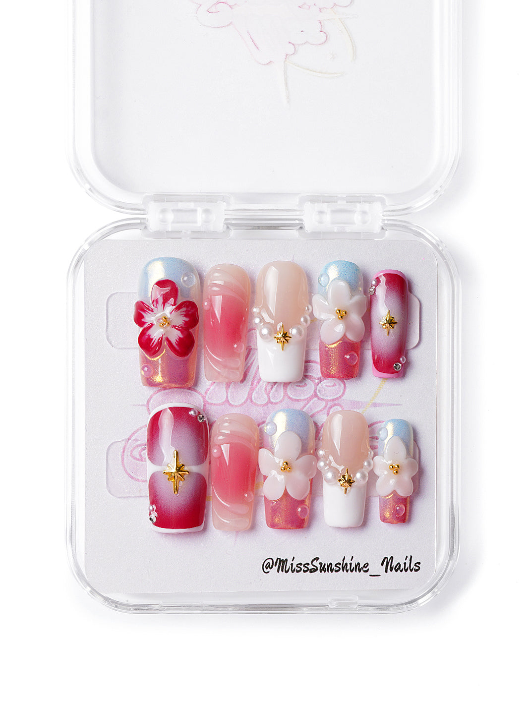 Handmade floral nails with pearl accents, shimmer, and soft pink-white ombré