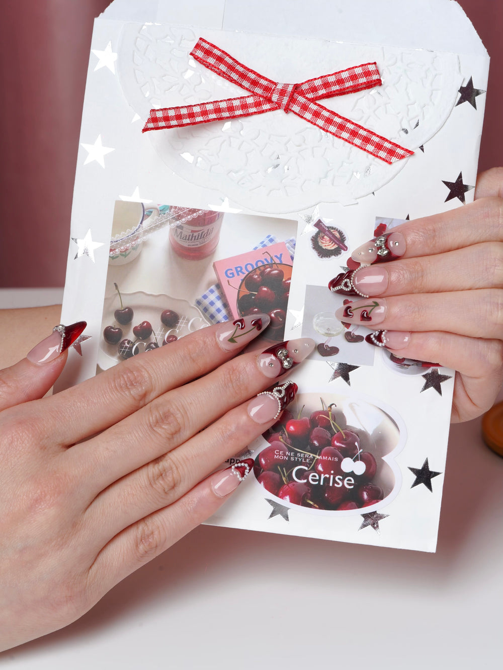 Romantic cherry kiss nails with glossy tips