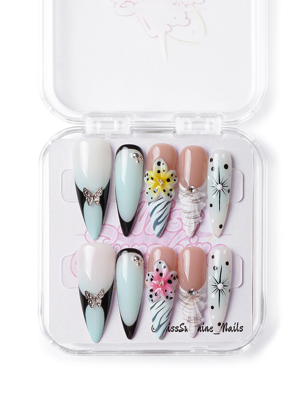 Handmade press-on nails featuring bold prints, rhinestone butterflies, and edgy floral accents