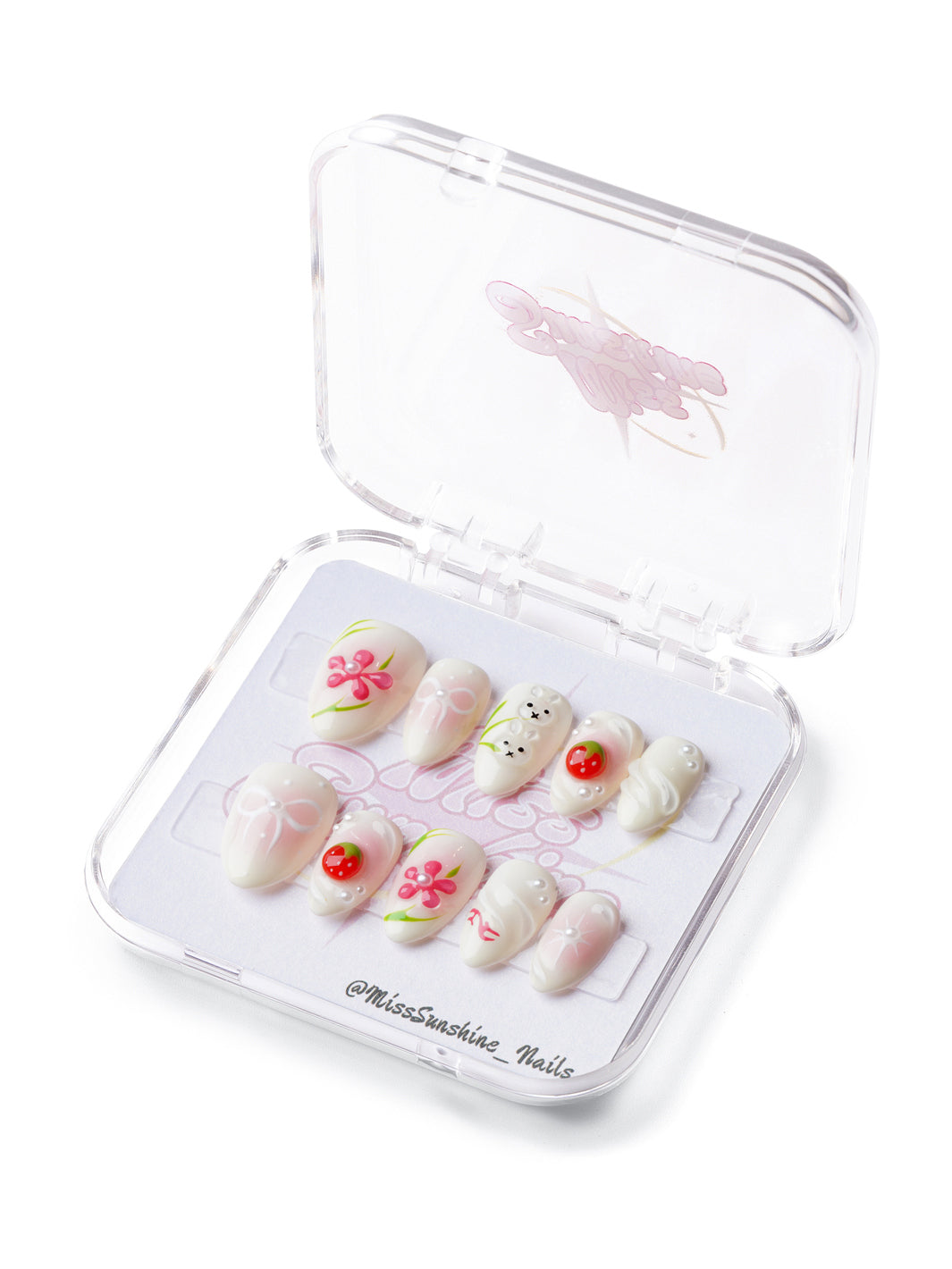Blossom Bunny extra short almond press-on nails with bunny, cherry, and floral designs on a soft milky yellow base.