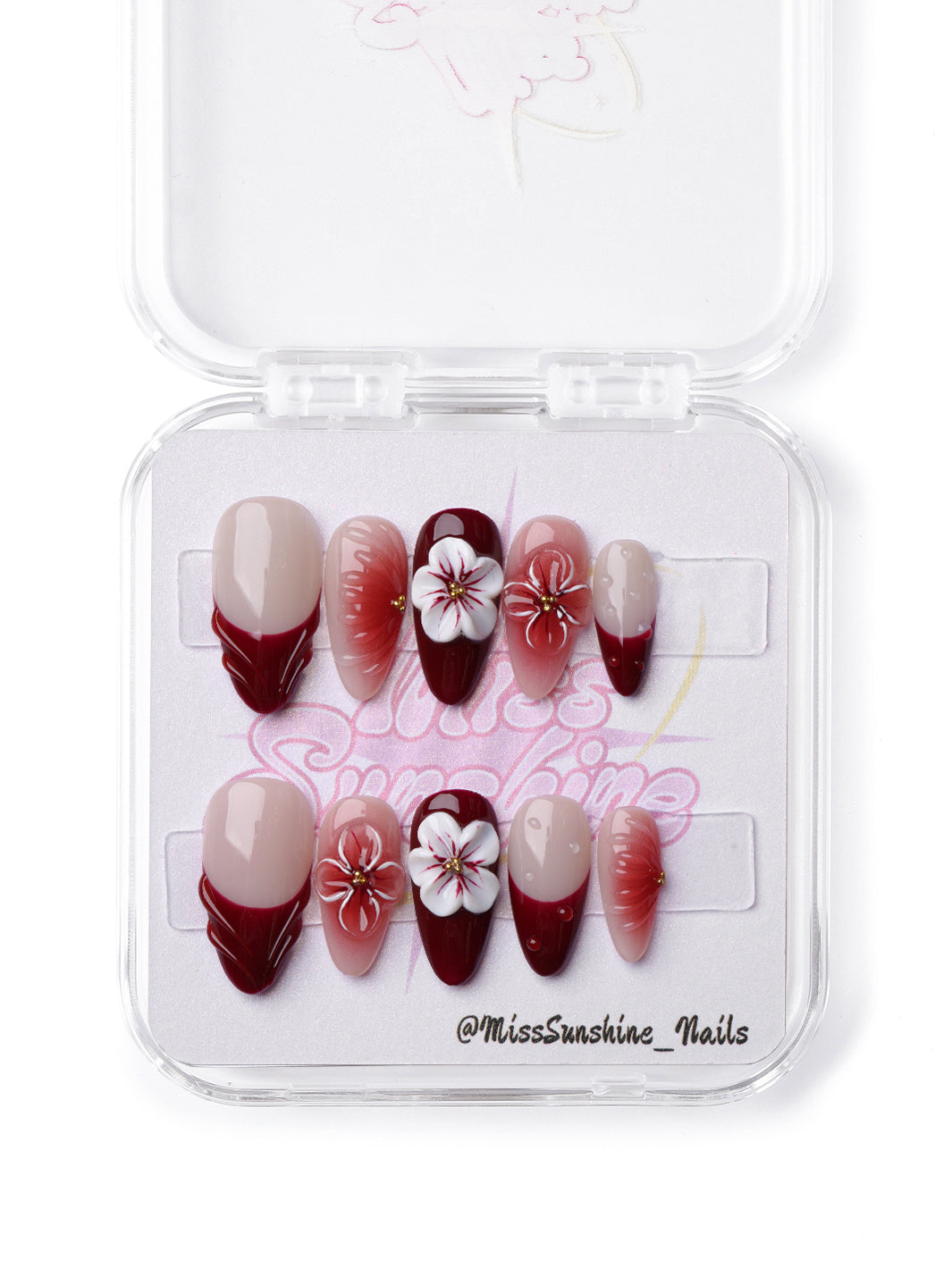 Elegant short almond nails featuring wine red tones, sculpted floral art, and soft glossy gradients.