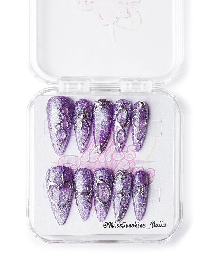 Gothic purple Halloween nails with sculptural silver details