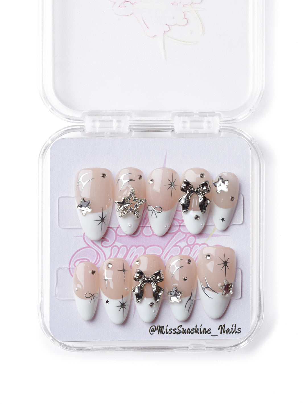 Elegant short almond press-on nails featuring silver accents, French tips, and coquette-inspired details