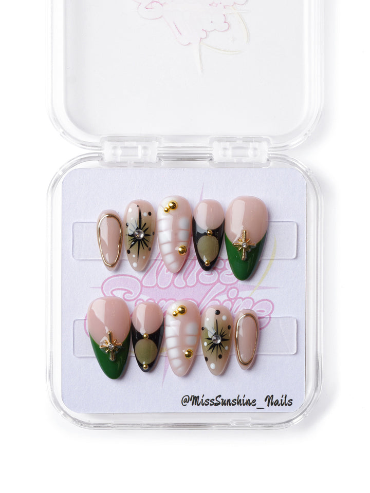 Edgy green and gold short almond press-on nails with intricate details, inspired by nature’s dangerous beauty.
