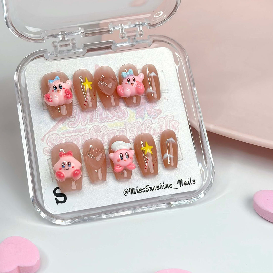 Short coffin nails with nude base and 3D Kirby