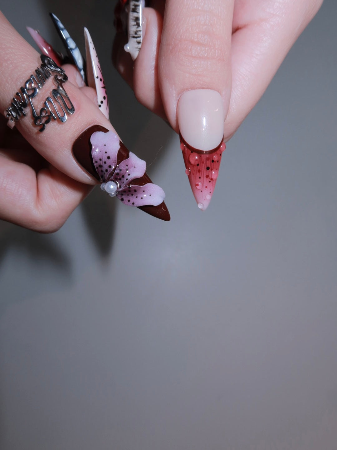 Hand-painted edgy nails with wild tropical flower accents