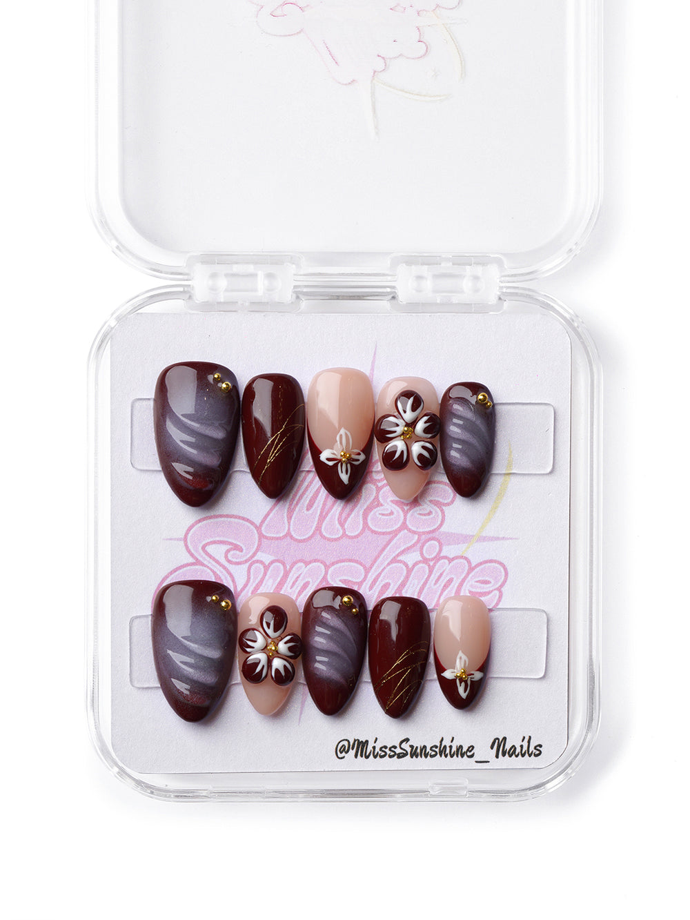 Elegant extra short almond nails with mocha swirls, hand-painted florals, and a soft glam finish.