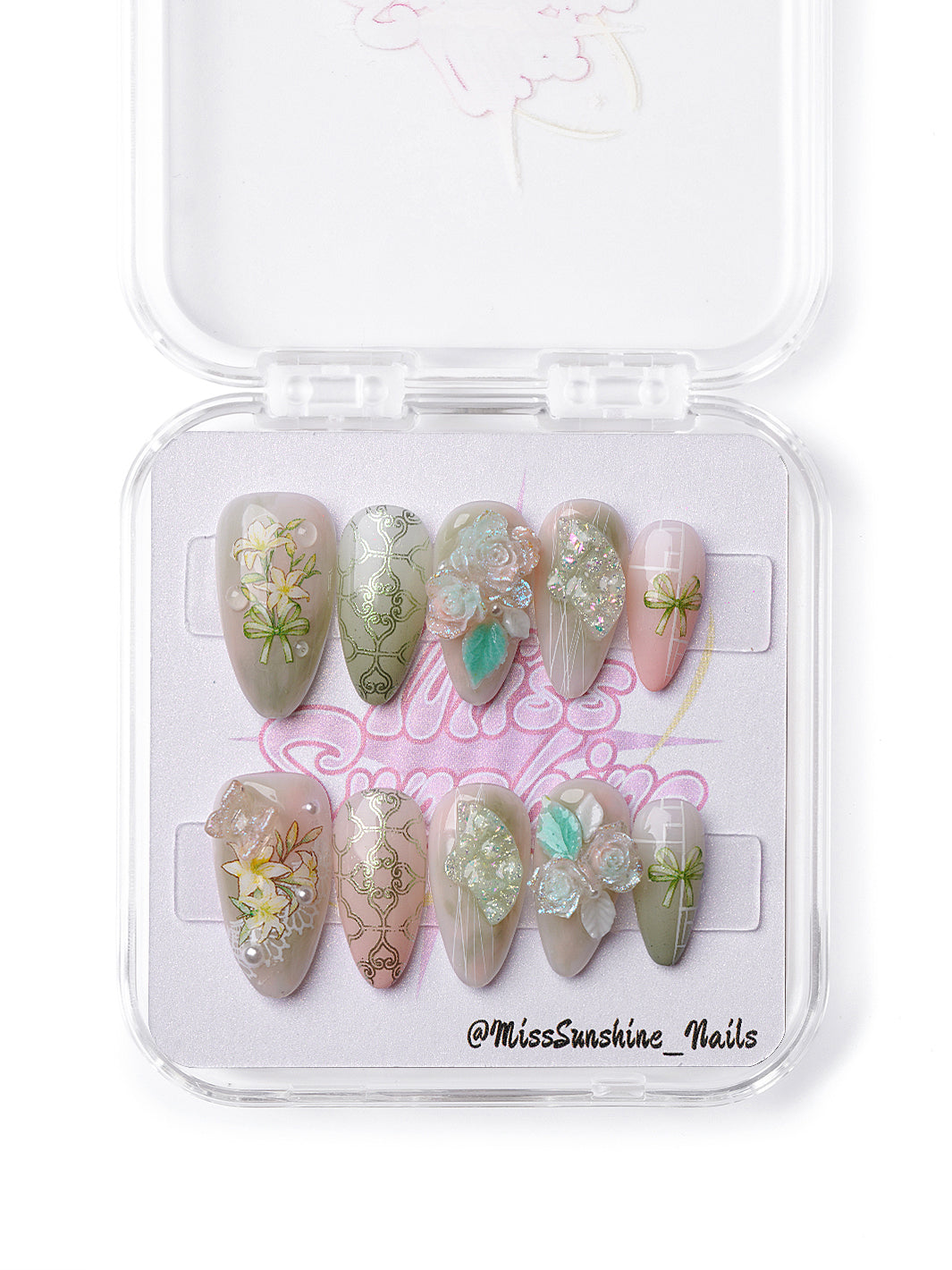 Handmade press-on nails inspired by nature with sage green details, botanical patterns, and sculpted floral art.