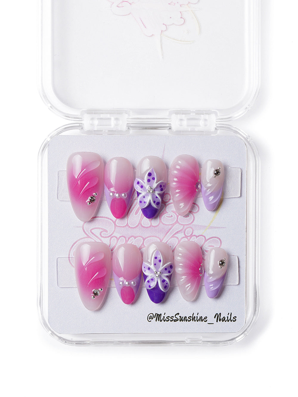 Handmade press-on nails featuring floral textures and glossy ombré gradient