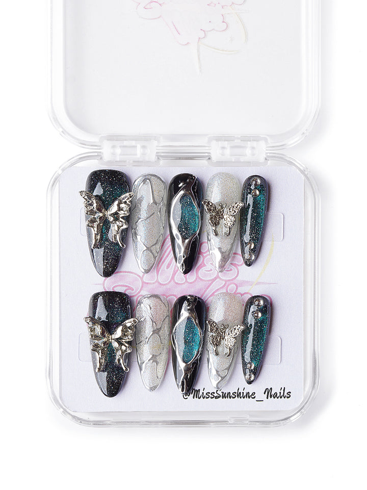 Long almond Halloween nails in black, jade, and silver glitter