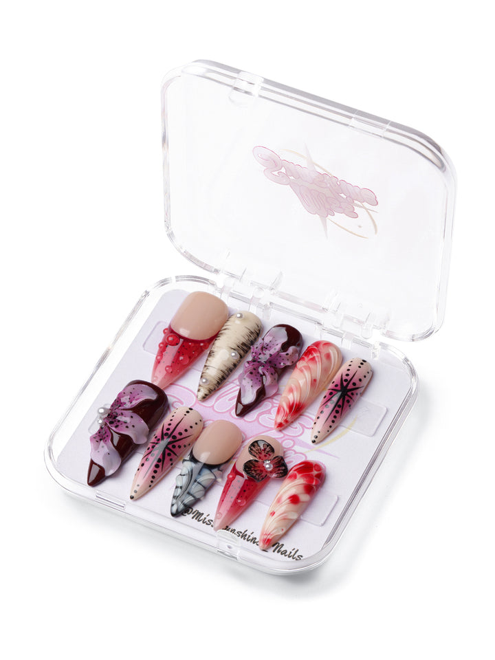 Jungle Flower long stiletto press-on nails with 3D flowers, animal print accents, and bold red-black floral designs.