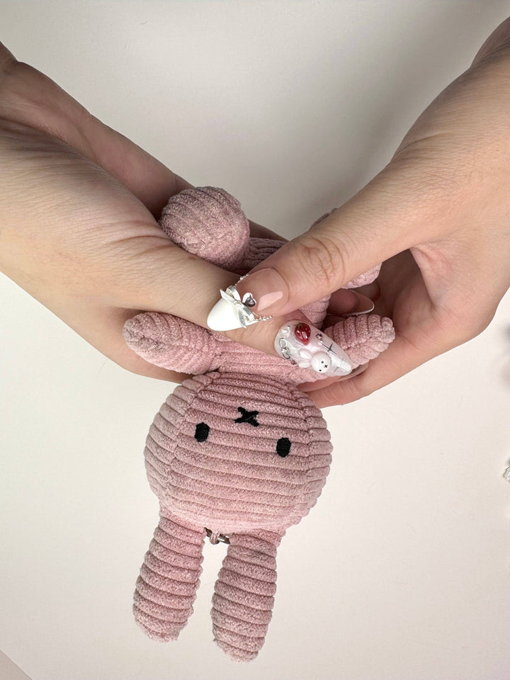Handmade pastel nails with cute charm details