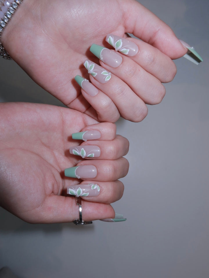 Blush nude and green nails with floral elegance