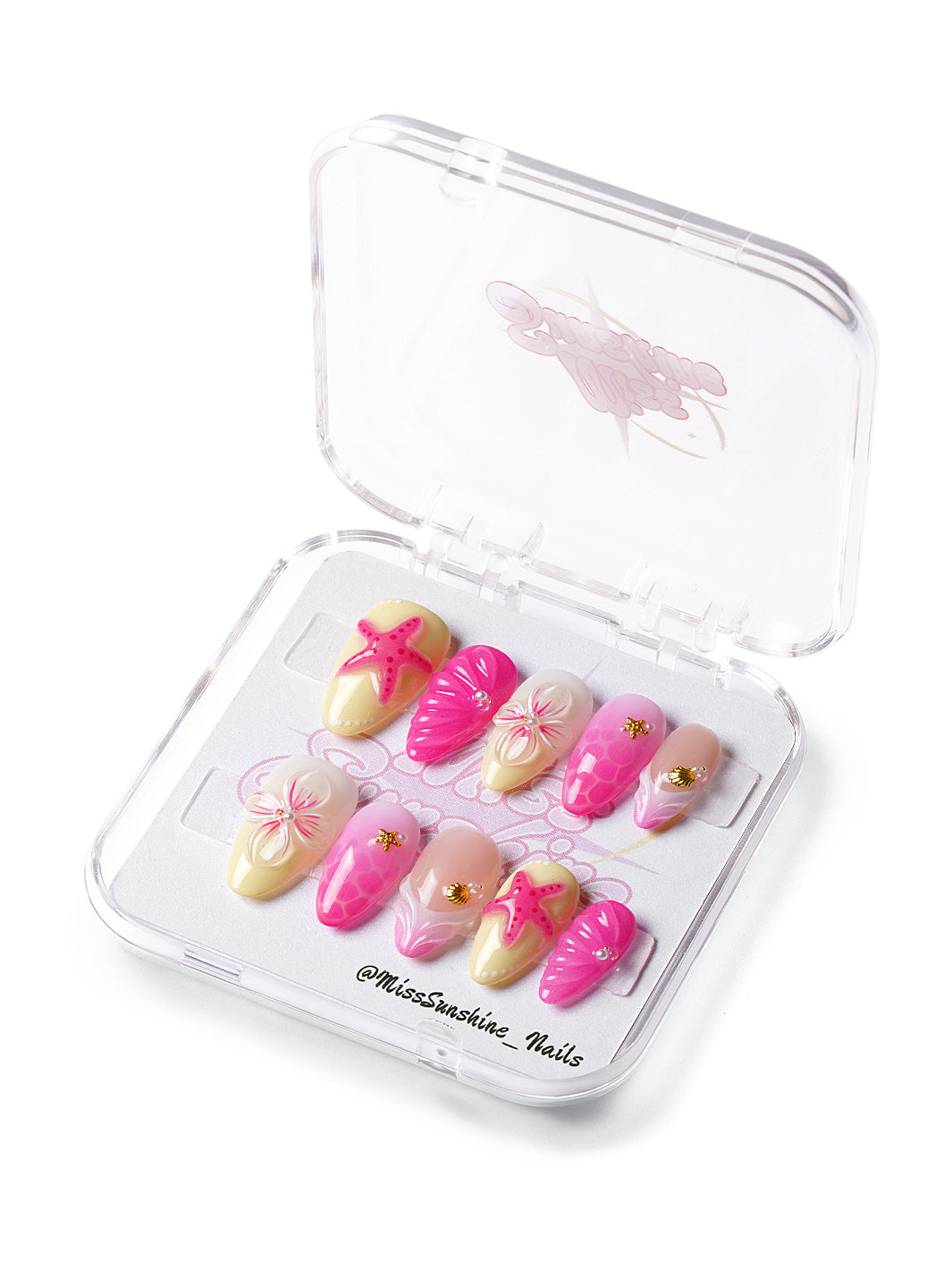 Short almond press-on nails with 3D pink starfish, seashell textures, and gold accents