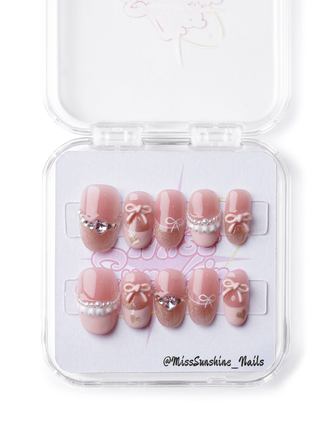 Vintage-inspired nail design featuring delicate lace details, pearls, and sparkling accents