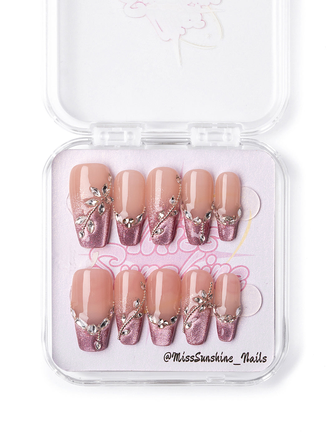 Glittery pink nails with vine-like jewel accents