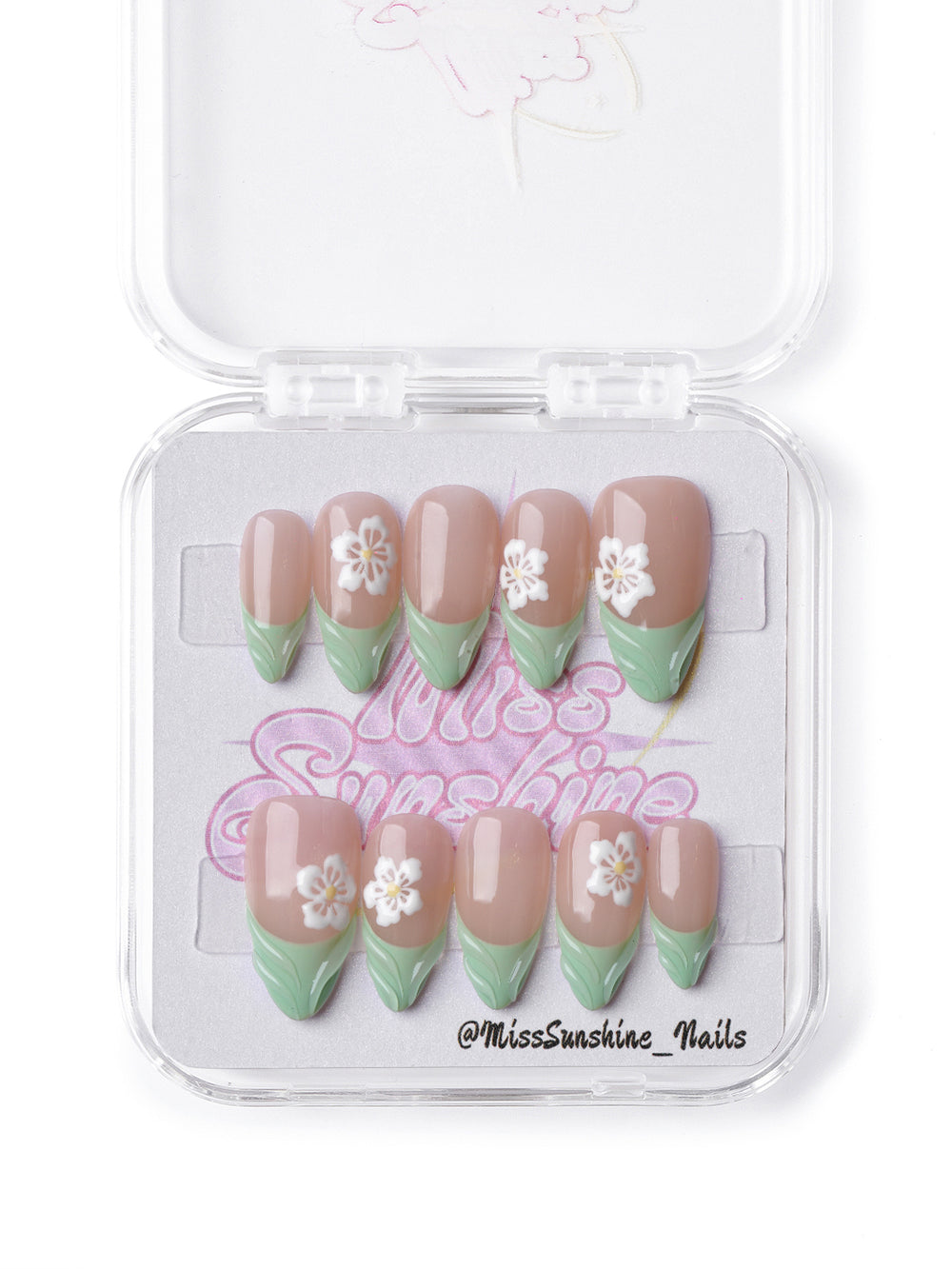 Short almond nude and green press-on nails with spring-inspired floral design.