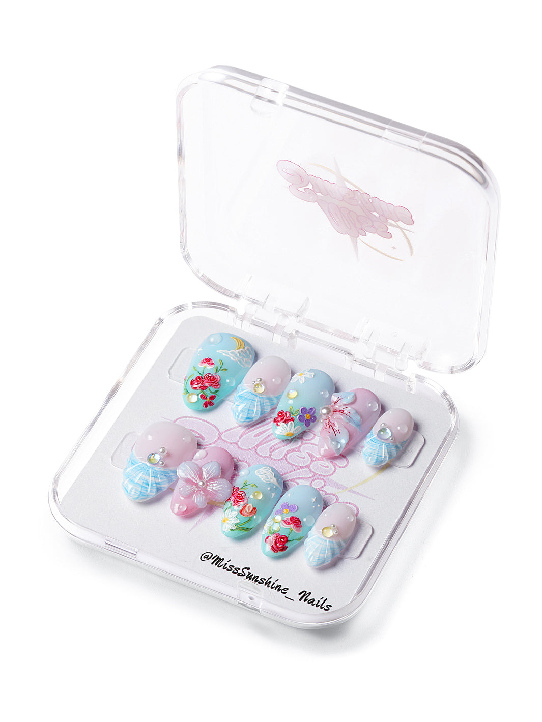 Short almond press-on nails with pastel florals, cloud and moon art, pearls, and soft sky tones