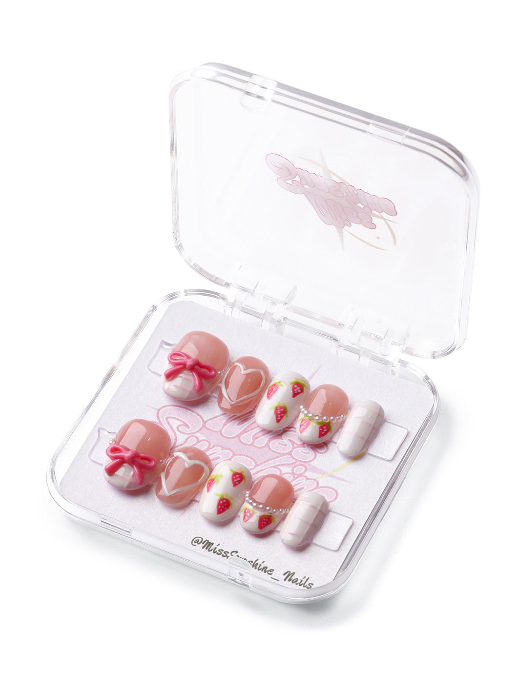 Strawberry Cream short oval press-on nails with strawberries, bows, hearts, and soft checkered accents.