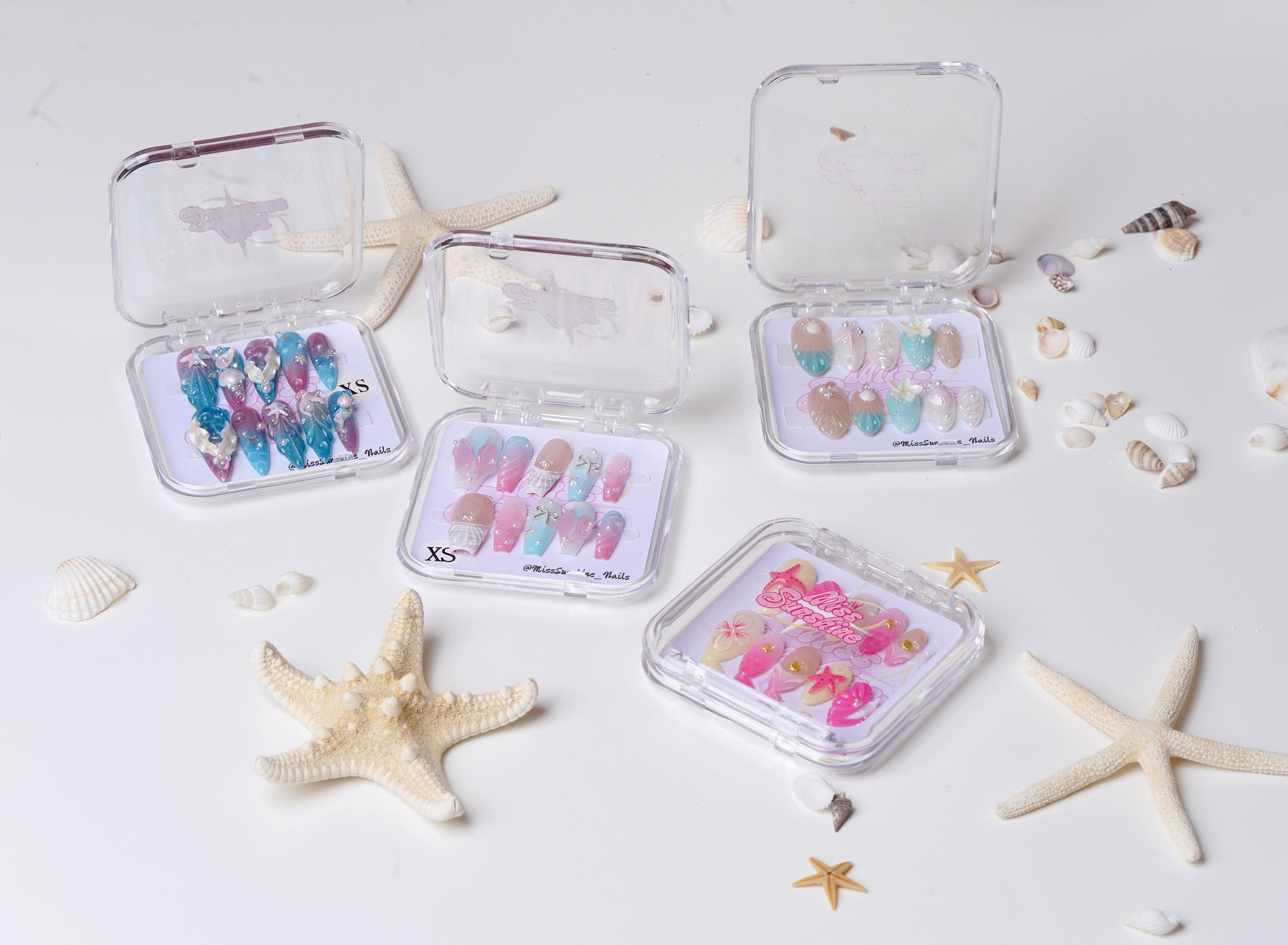 A vibrant mix of handmade press-on nails for summer—featuring 3D designs, shimmer finishes, and island-inspired themes