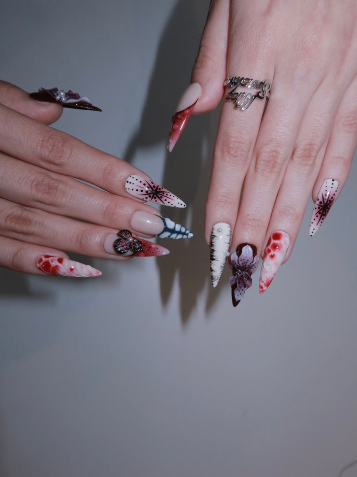 Press-on nails with exotic butterfly and marble swirl detail