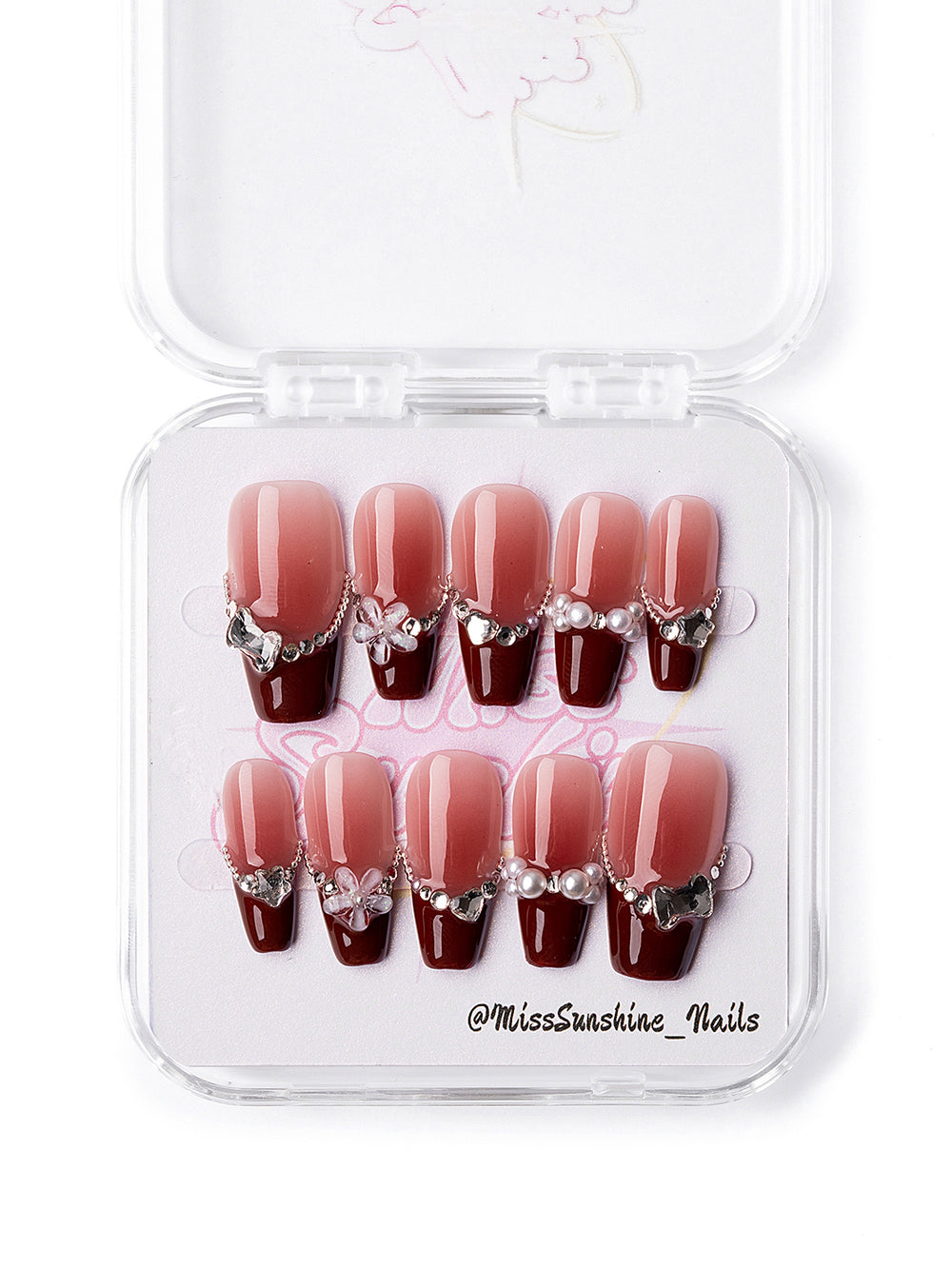 Miss Sunshine handmade nail art with red tips and jewelry elements