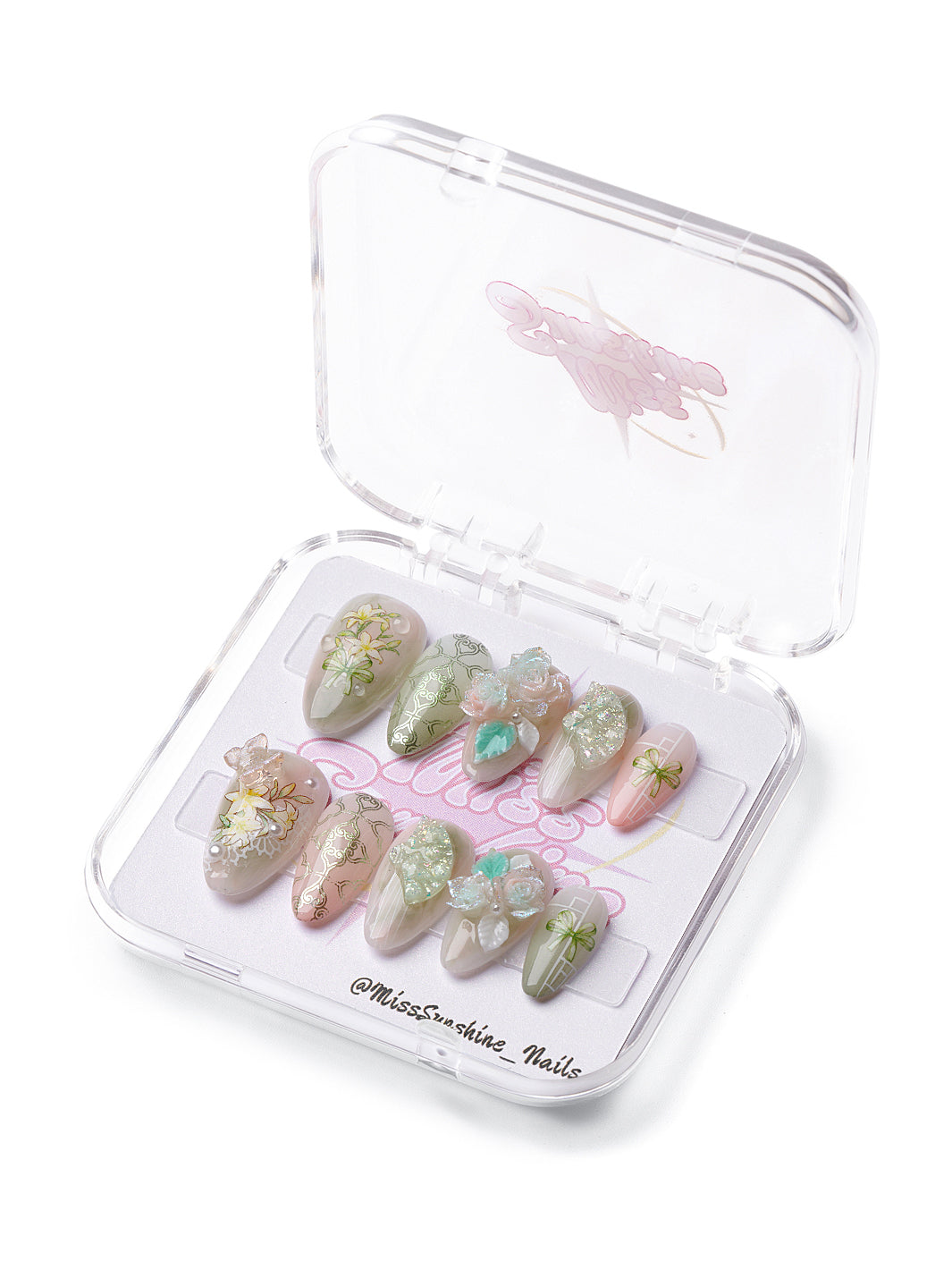 Zen Garden short almond press-on nails with soft green tones, floral accents, 3D flowers, and glitter textures.