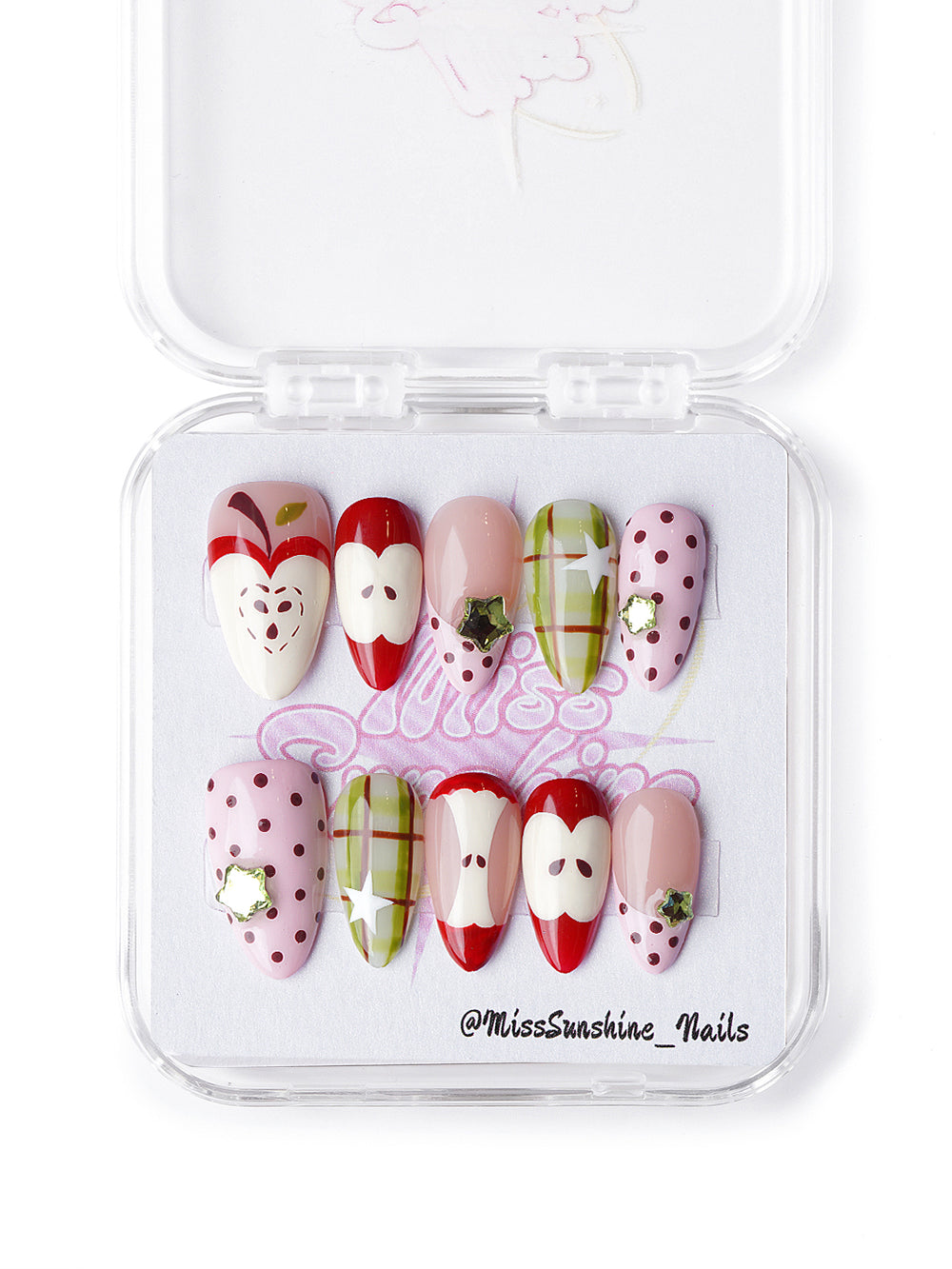 Hand-painted apple press-on nails with blush base, gingham print, and red fruit illustrations