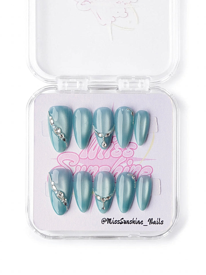 Aqua blue cat eye prom press on nails with rhinestones