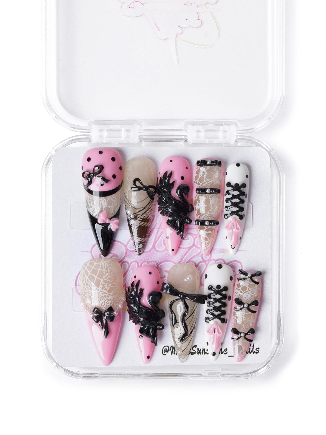 Ballet-inspired press-on nails with pink and black corset details