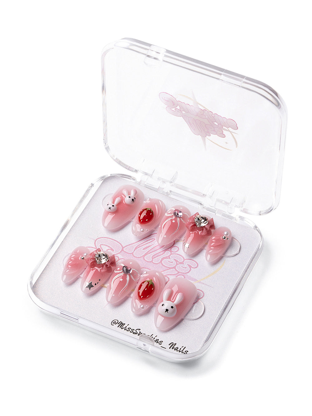 Short almond press-on nails with 3D bunnies and strawberry art