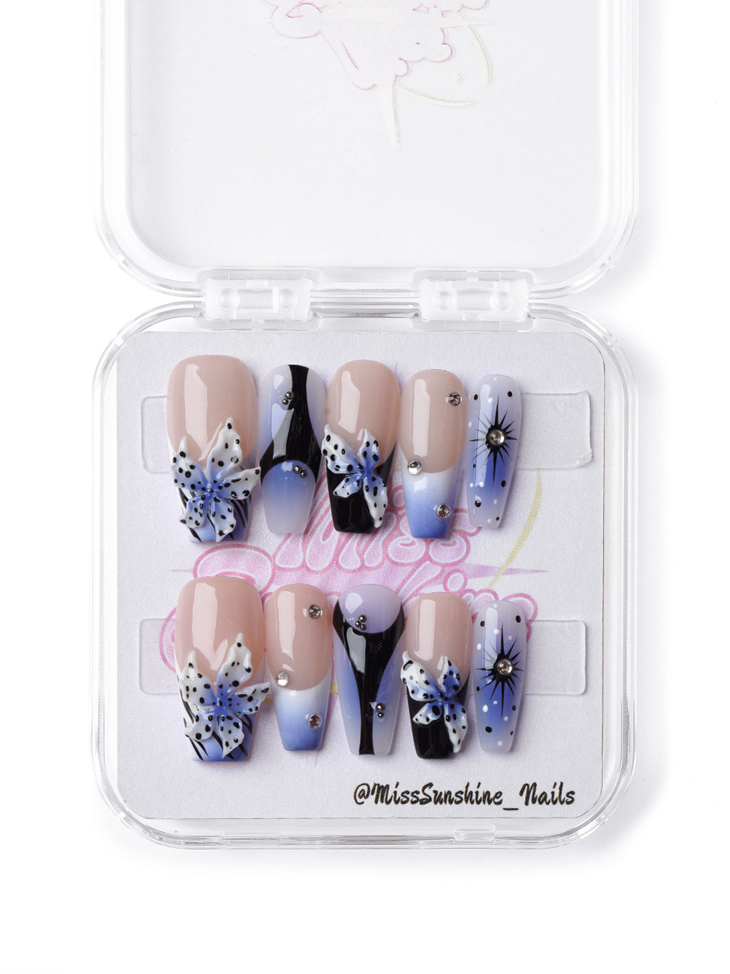 Handmade press-on nails featuring blue ombré, rhinestones, and bold floral design