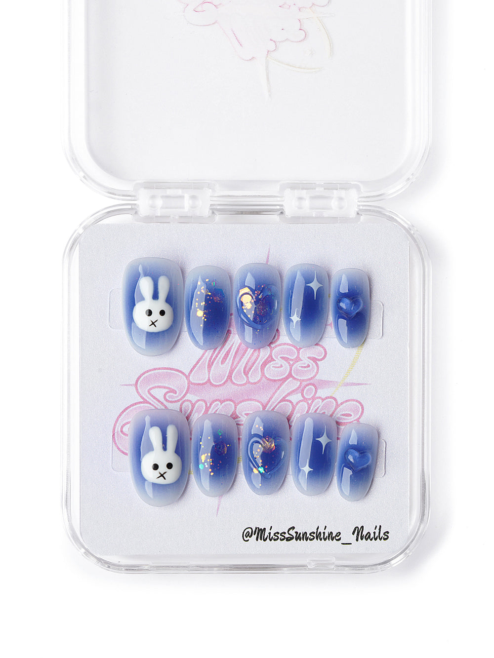 Cute blue press ons with bunny art, star decals, and iridescent glitter details
