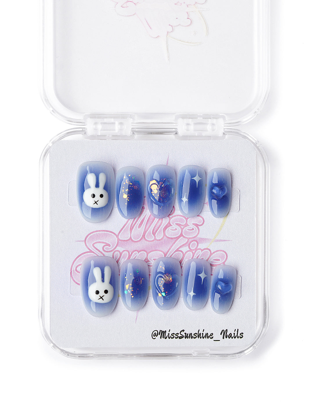 Cute blue press ons with bunny art, star decals, and iridescent glitter details