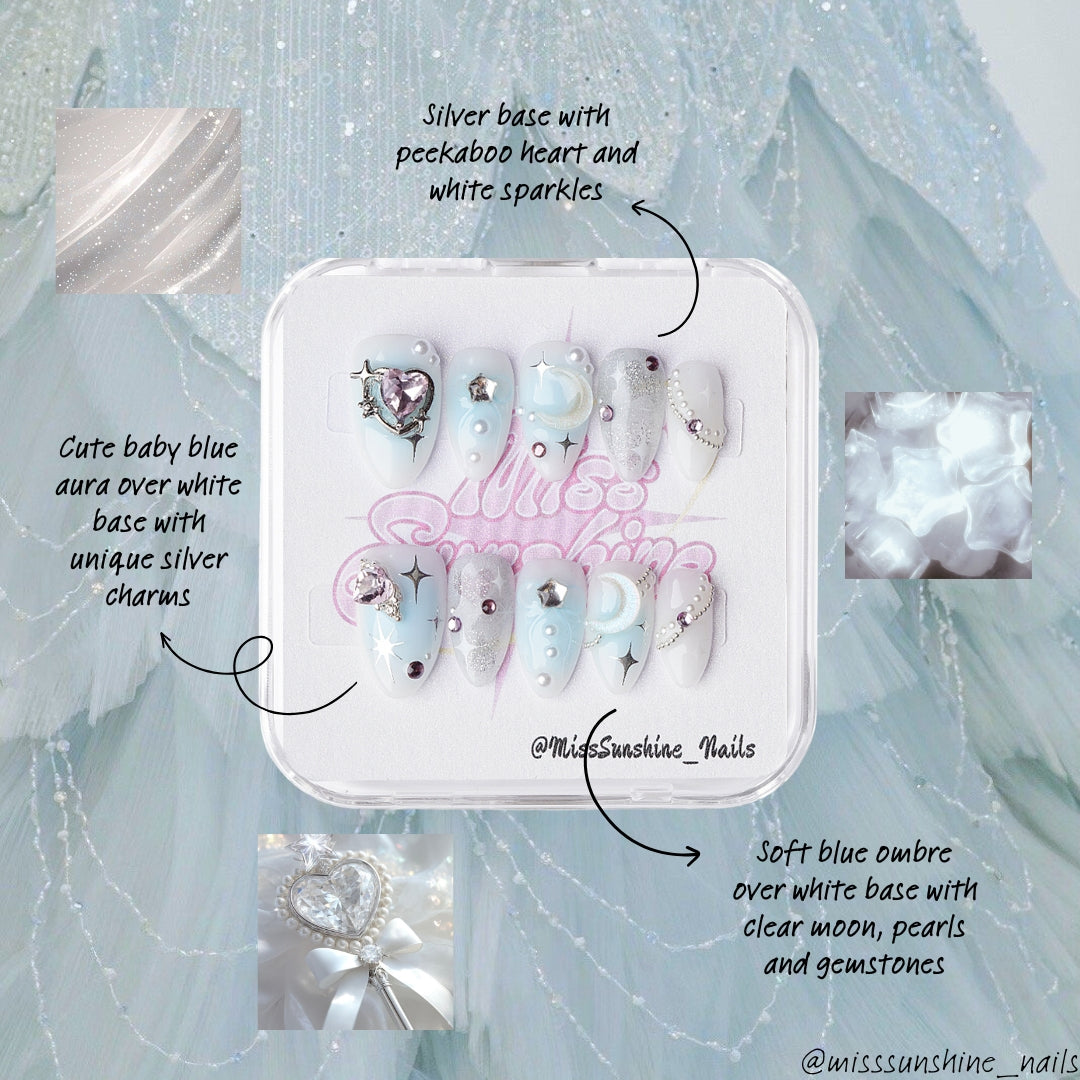 Winter celestial press-on nails with moon designs, stars, and sparkling decorations