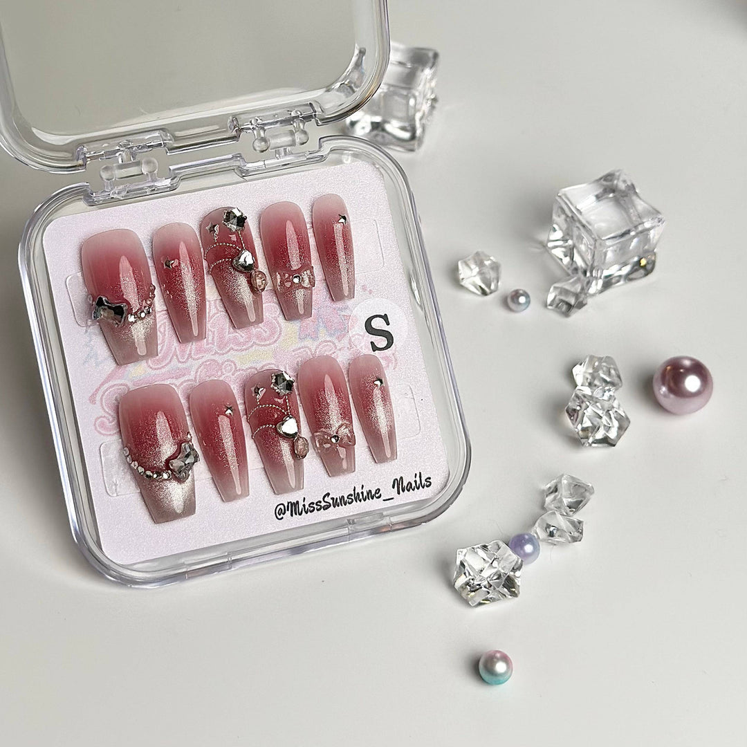 Medium long coffin press-on nails in blush cat eye pink