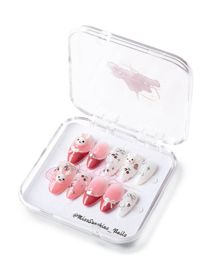 Blushing bunny press-on nails with red ombré and cute charms