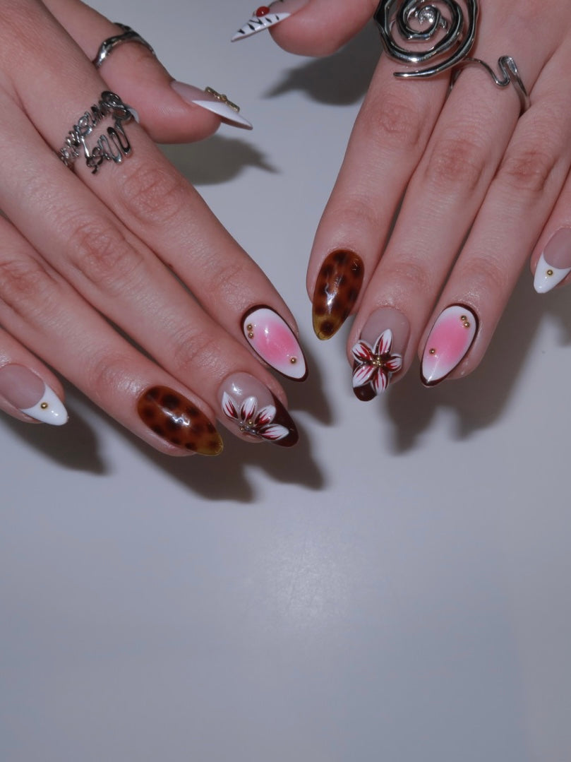 Pink gradient nails with 3D floral art