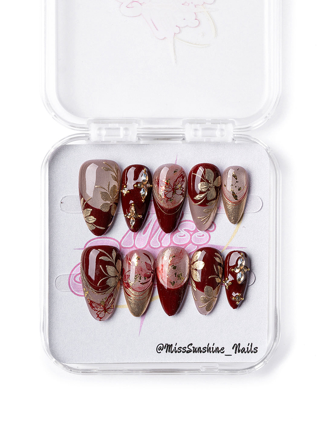 Red Elegance nail set featuring shimmer and flower accents