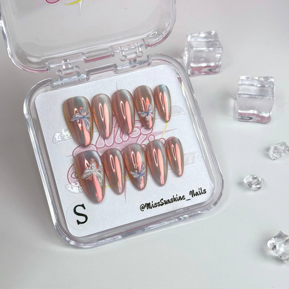 Glossy holographic nails with butterfly details