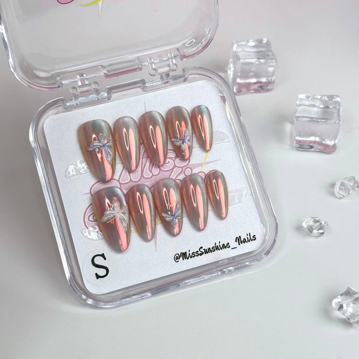 Glossy holographic nails with butterfly details