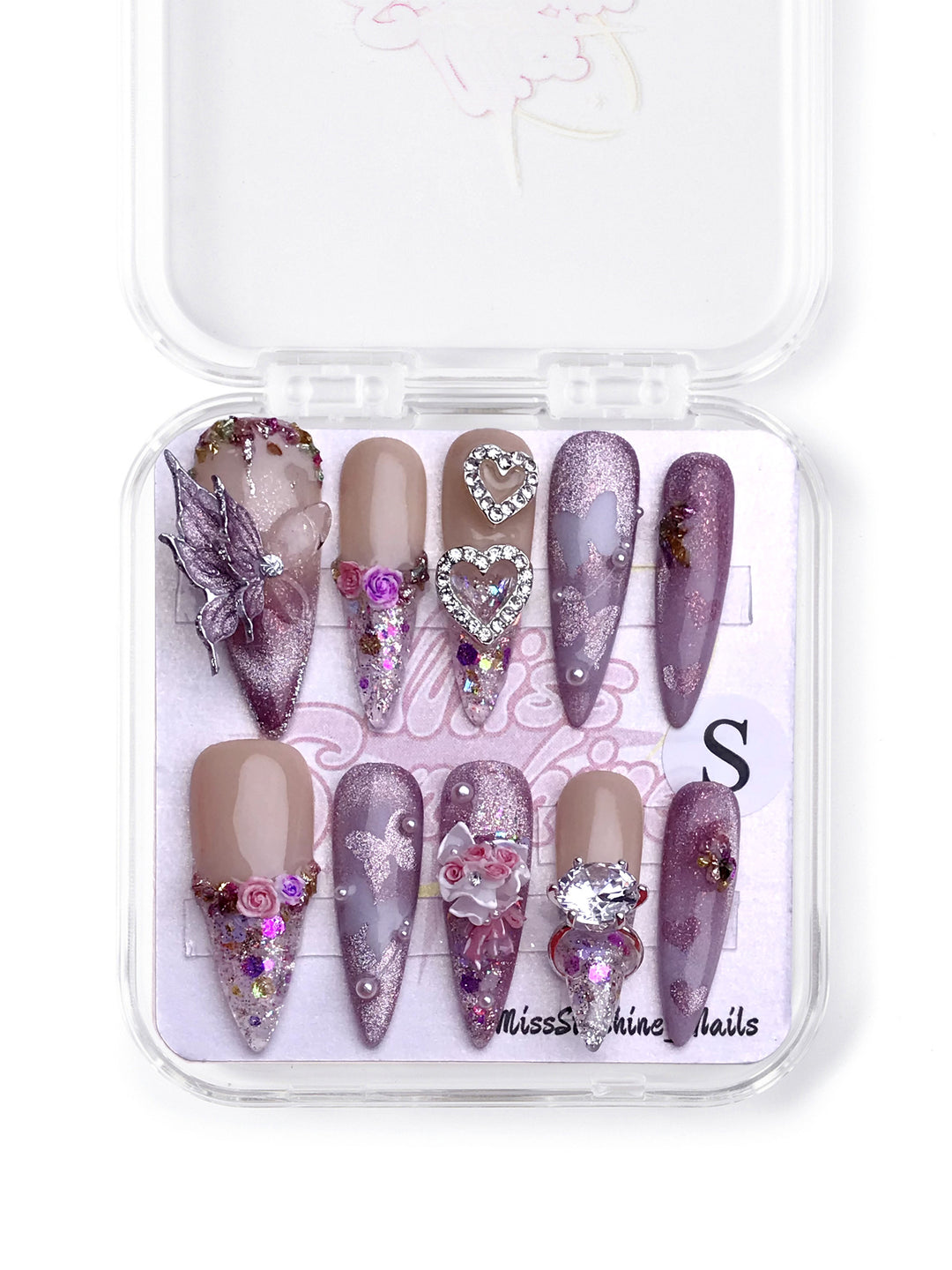 Butterfly Ring long stiletto press-on nails with glittery lavender tones, floral accents, and a 3D butterfly ring for Valentine’s Day