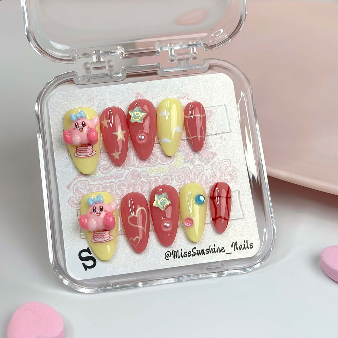 Cake Kirby press-on nails with 3D figures and candy art