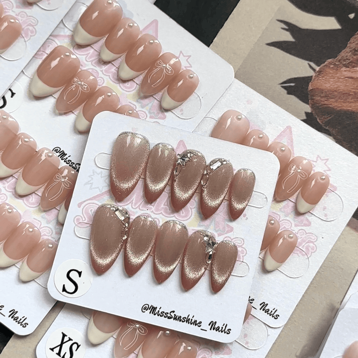 Nude press-on nails with crystal embellishments
