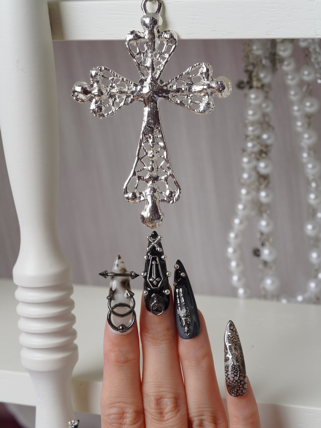 Chained Curse nails featuring metallic crosses and skeleton art of halloween