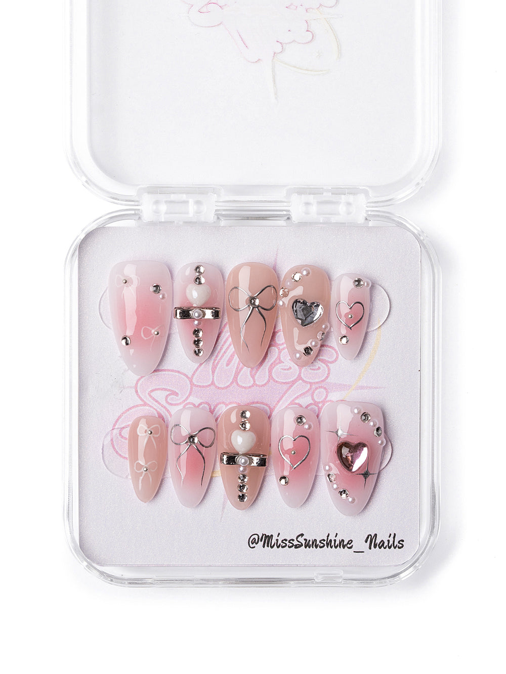 Y2K style press-on nails featuring silver heart charms