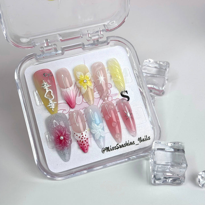Beach-inspired 3D nails in soft pink and pearl tones