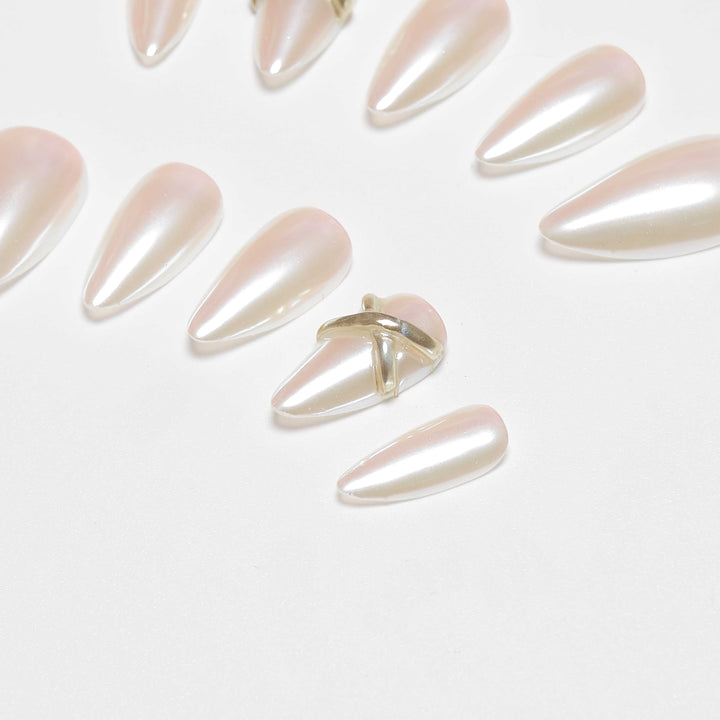 Short almond chrome nails with gold cross