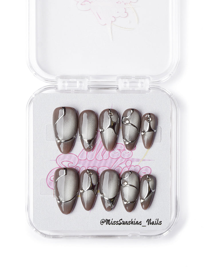 Handmade gray and silver press on nails with molten metal swirls and rhinestones